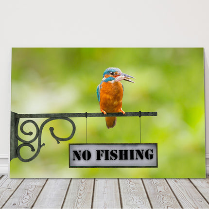 king fisher caught a fish sitting on a no fishing sign canvas picture print