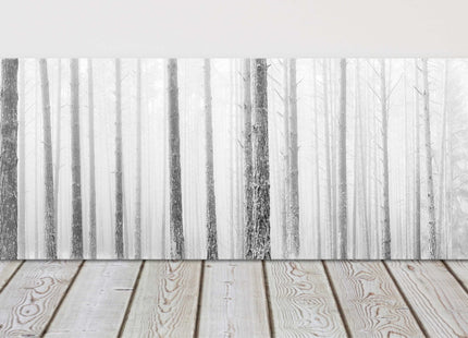 Pine trees in winter fog. Panoramic canvas picture print. Black and white.