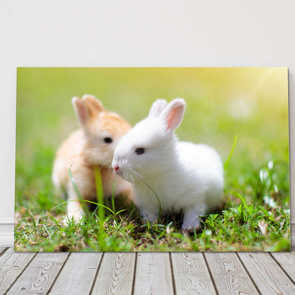 Baby rabbits in the garden. Cute animals. Printed as a canvas picture.