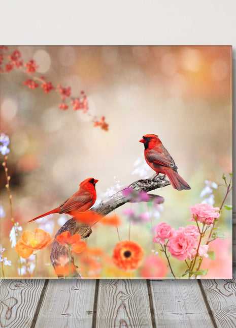 Birds and flowers. Colourful birds perched on a branch. Canvas picture print.