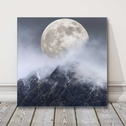 Super moon above a mountain range. Printed as a canvas picture print.