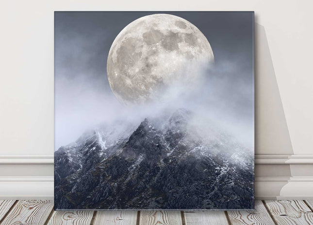 Super moon above a mountain range. Printed as a canvas picture print.