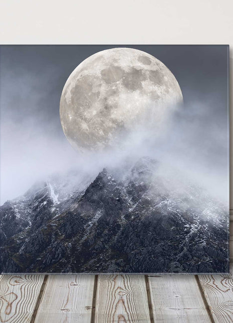 Super moon above a mountain range. Printed as a canvas picture print.