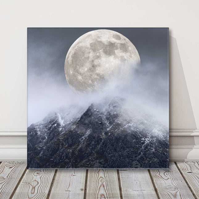 Super moon above a mountain range. Printed as a canvas picture print.