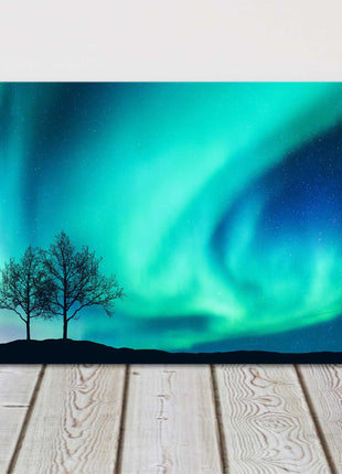 Northern lights over the trees. Panoramic canvas picture print.