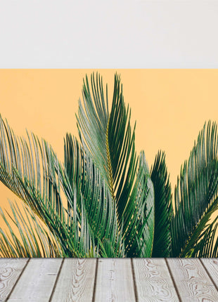 Tropical palm tree on a yellow background. Canvas picture print. Modern art