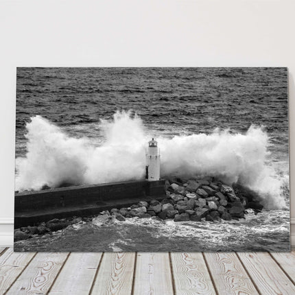 Waves crashing over a lighthouse black and white canvas picture print