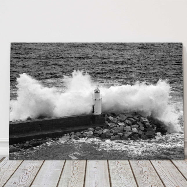 Waves crashing over a lighthouse black and white canvas picture print