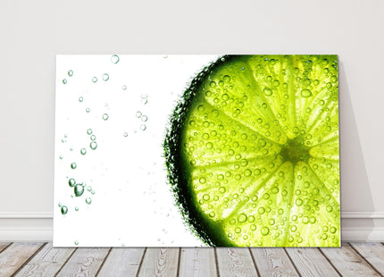 Lime slice in water bubbles. Canvas picture print.