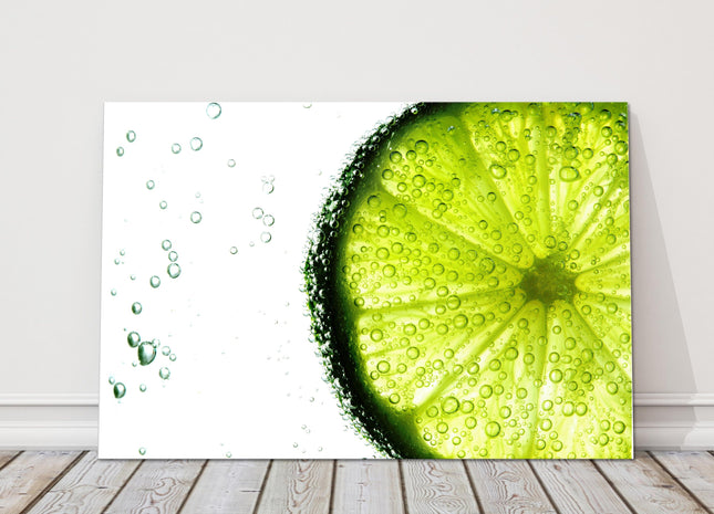 Lime slice in water bubbles. Canvas picture print.