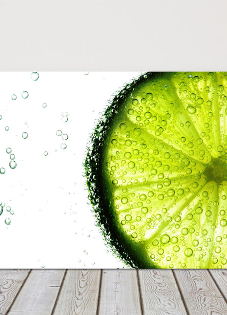 Lime slice in water bubbles. Canvas picture print.