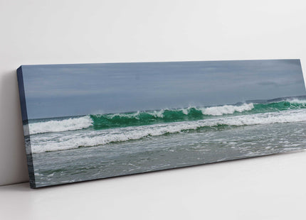 Breaking waves on the Cornish coast. Panoramic Canvas picture print.