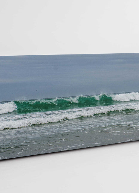 Breaking waves on the Cornish coast. Panoramic Canvas picture print.