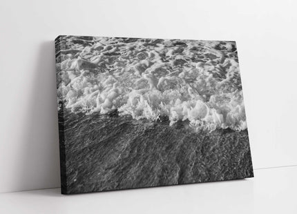 Waves rolling in to the shore of a beach. Black and white canvas picture