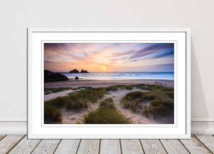 Holywell bay at sunset. Framed picture print with a choice of frame colours.