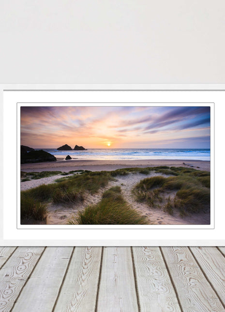 Holywell bay at sunset. Framed picture print with a choice of frame colours.