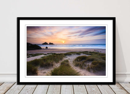 Holywell bay at sunset. Framed picture print with a choice of frame colours.