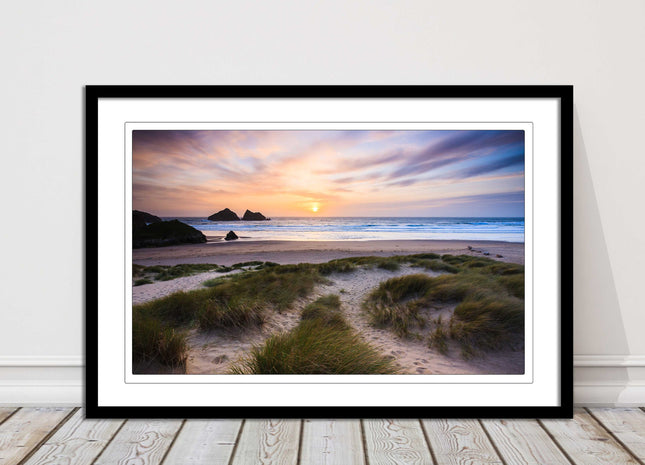 Holywell bay at sunset. Framed picture print with a choice of frame colours.