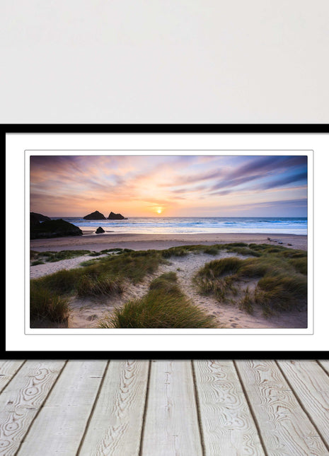 Holywell bay at sunset. Framed picture print with a choice of frame colours.