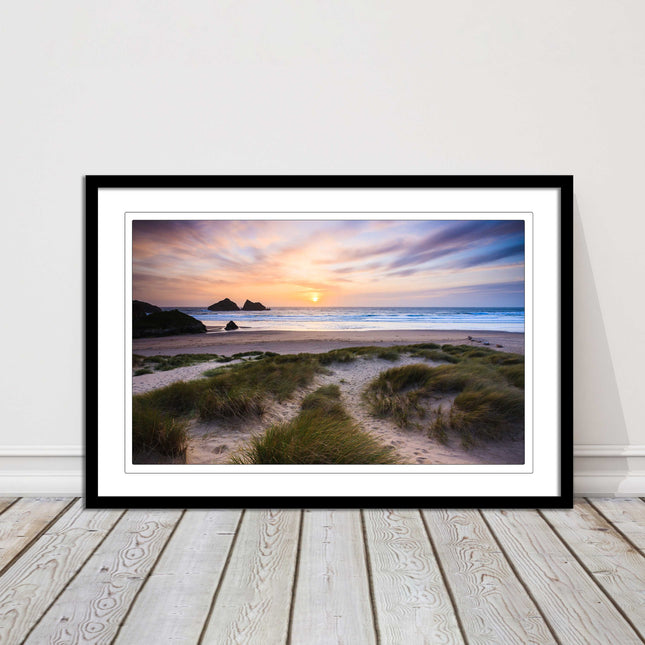 Holywell bay at sunset. Framed picture print with a choice of frame colours.
