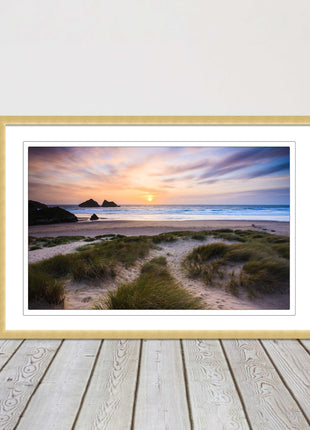 Holywell bay at sunset. Framed picture print with a choice of frame colours.