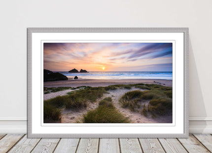 Holywell bay at sunset. Framed picture print with a choice of frame colours.
