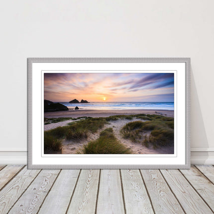 Holywell bay at sunset. Framed picture print with a choice of frame colours.