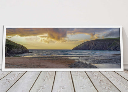 Mawgan Porth at sunset. Panoramic framed picture print. A choice of frames.