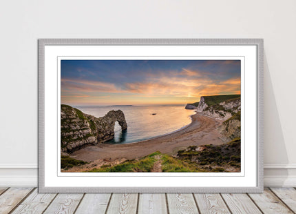 Durdle door at sunset, Dorset. Framed picture with a choice of frame colours.