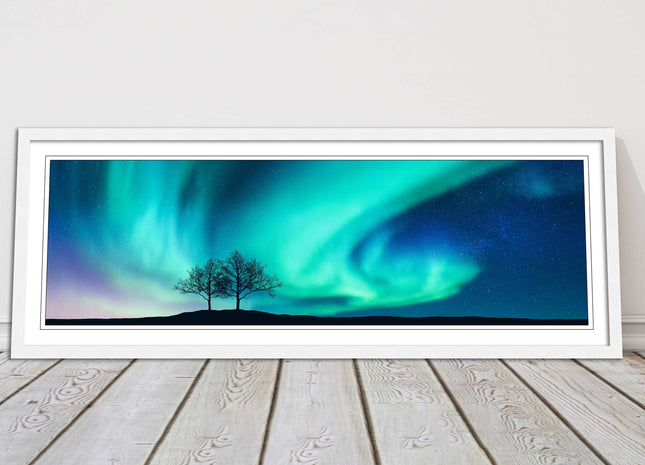 Aurora Borealis, with silhouette of trees. Panoramic framed picture print choice