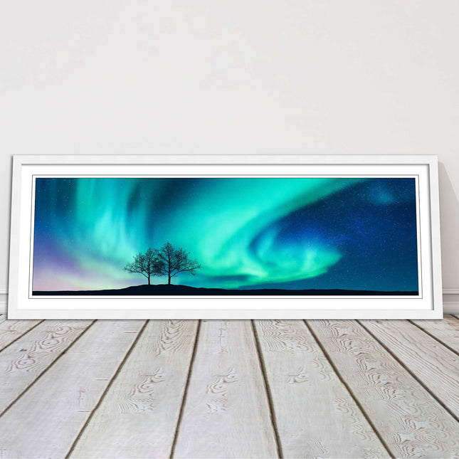 Aurora Borealis, with silhouette of trees. Panoramic framed picture print choice