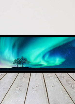 Aurora Borealis, with silhouette of trees. Panoramic framed picture print choice