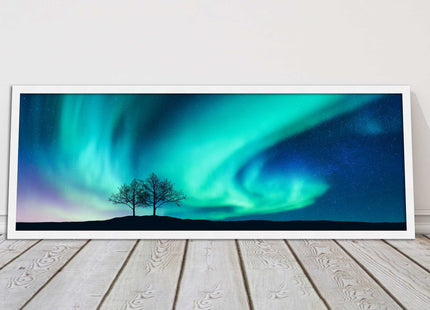 Aurora Borealis, with silhouette of trees. Panoramic framed picture print choice