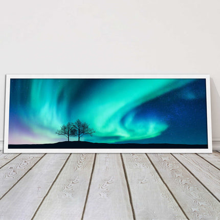 Aurora Borealis, with silhouette of trees. Panoramic framed picture print choice