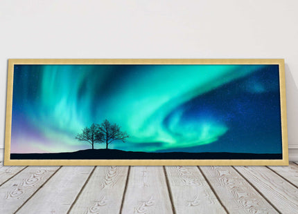Aurora Borealis, with silhouette of trees. Panoramic framed picture print choice