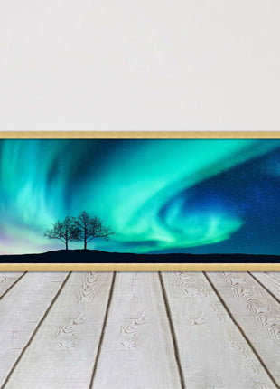 Aurora Borealis, with silhouette of trees. Panoramic framed picture print choice