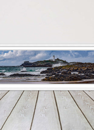 Godrevy Lighthouse with breaking waves at the shore. Cornwall. Framed picture