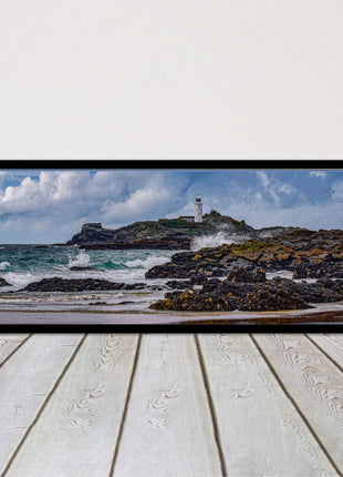 Godrevy Lighthouse with breaking waves at the shore. Cornwall. Framed picture