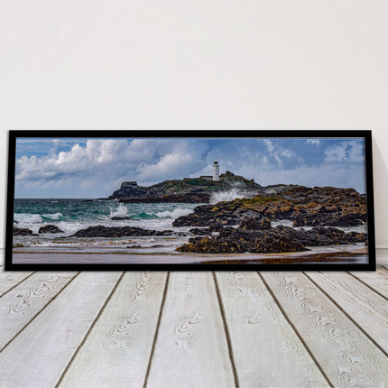 Godrevy Lighthouse with breaking waves at the shore. Cornwall. Framed picture