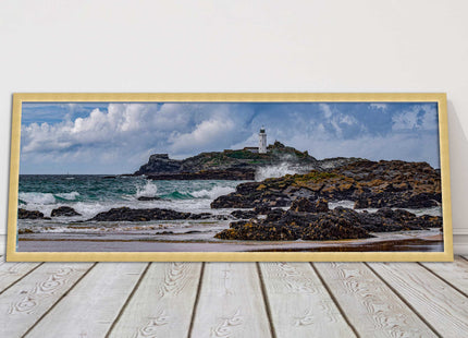 Godrevy Lighthouse with breaking waves at the shore. Cornwall. Framed picture