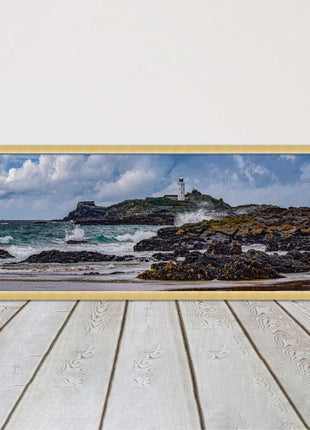 Godrevy Lighthouse with breaking waves at the shore. Cornwall. Framed picture