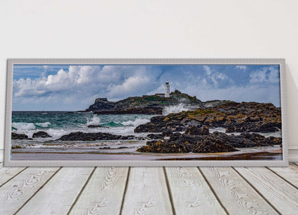 Godrevy Lighthouse with breaking waves at the shore. Cornwall. Framed picture