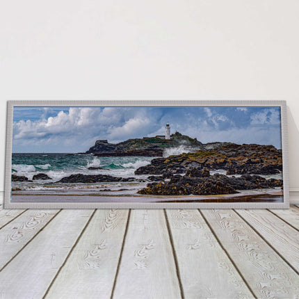 Godrevy Lighthouse with breaking waves at the shore. Cornwall. Framed picture