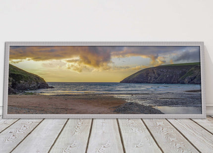 Mawgan Porth at sunset. Panoramic framed picture print. A choice of frames.