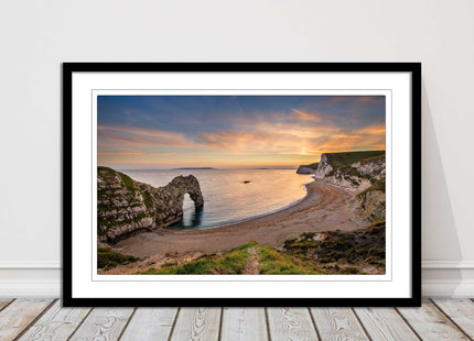 Durdle door at sunset, Dorset. Framed picture with a choice of frame colours.