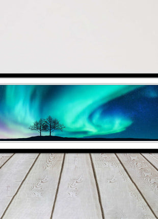 Aurora Borealis, with silhouette of trees. Panoramic framed picture print choice