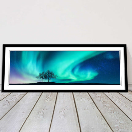 Aurora Borealis, with silhouette of trees. Panoramic framed picture print choice