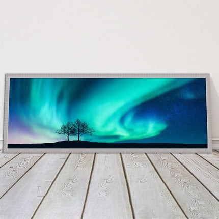 Aurora Borealis, with silhouette of trees. Panoramic framed picture print choice