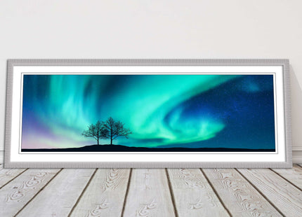 Aurora Borealis, with silhouette of trees. Panoramic framed picture print choice