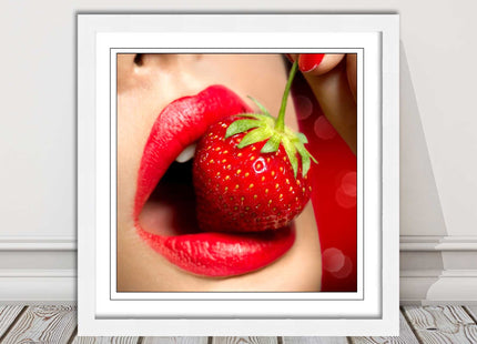 Strawberry red lips eating framed picture print with choice frame colours